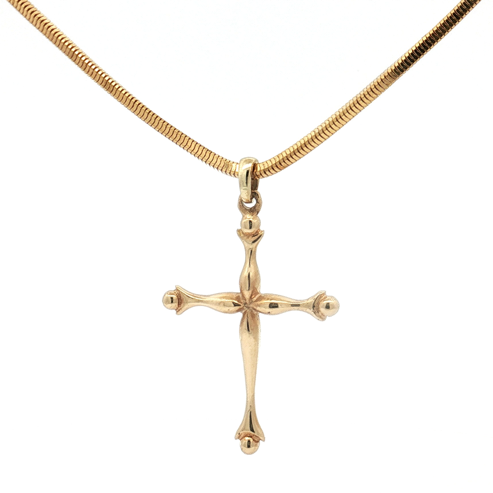 Gold cross pendant on a gold chain against a white background